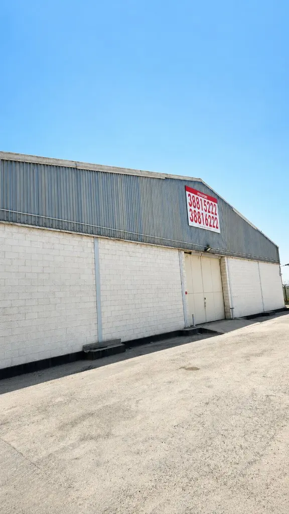 Warehouse unit in Sitra with a For Rent sign