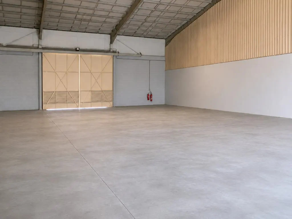 Empty warehouse interior with beige industrial doors
