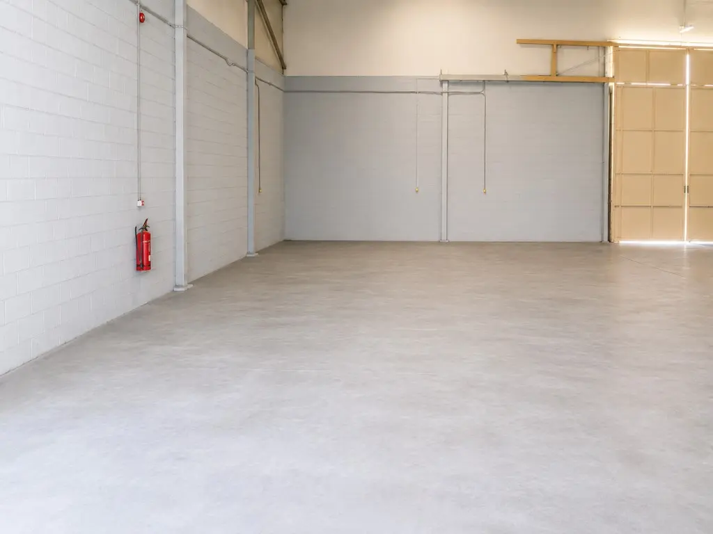 Empty warehouse interior looking along the side wall